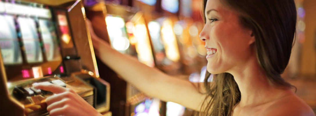 Happy Woman Playing Slots in Las Vegas Casino