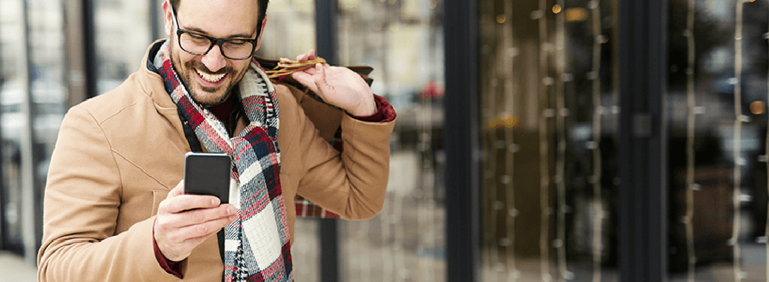 Man Checking Las Vegas Black Friday Deals on Phone