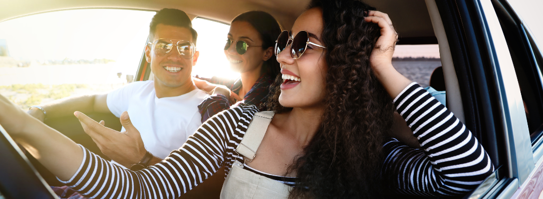 Happy Friends in Car on Las Vegas Road Trip